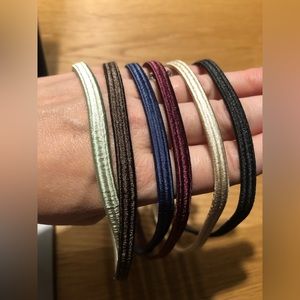 Never worn! 6 multi-colored Scünci thin headbands that will hold in place!